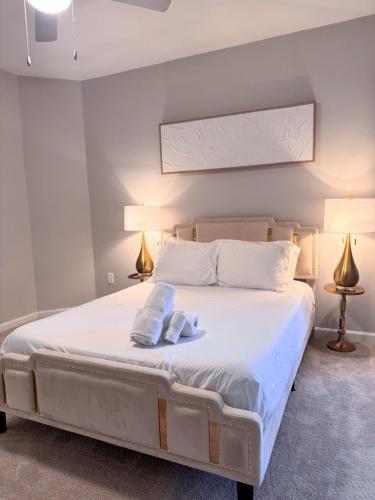 a bedroom with a bed with two pillows on it at Dulles Corner Escape - 5 min from Airport in Herndon