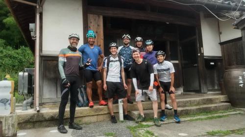 a group of people posing for a picture in front of a house at Guest House Miei - Vacation STAY 87536v in Nagahama