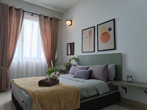a bedroom with a bed and a window at Prestige Sky Riverfront in Kota Bharu