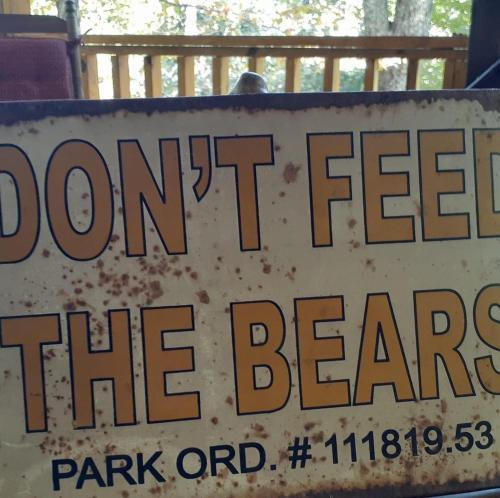 a sign that reads dont feed the bears at Little Bear Tiny Cabin in Cosby