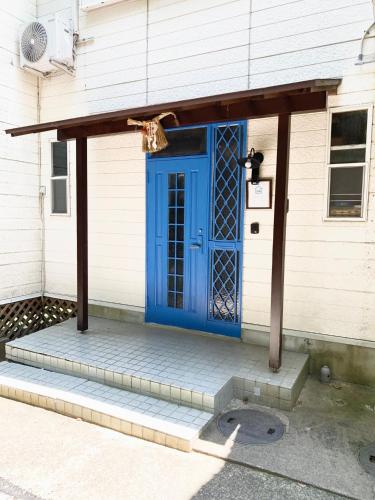 a blue door on the side of a house at ISU BASE - Vacation STAY 12851 in Shima