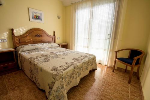 Katil atau katil-katil dalam bilik di Hostal O Camouco