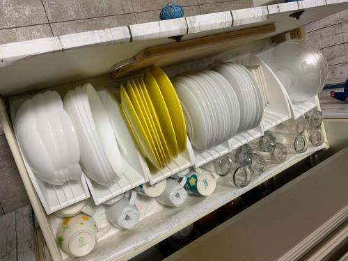 a shelf filled with plates and cups and bowls at ISU BASE - Vacation STAY 12851 in Shima