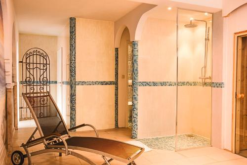 a bathroom with a treadmill and a shower at Hotel SleepInn Volkspark in Hamburg