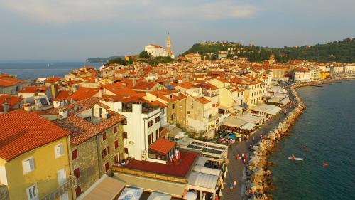 an aerial view of a town next to the water at Apartments & Rooms Riva in Piran