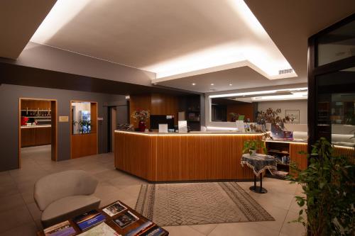 a lobby with a reception desk in a store at CityHotel Cristina Vicenza in Vicenza