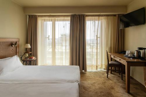 Ένα ή περισσότερα κρεβάτια σε δωμάτιο στο Best Western Vilnius