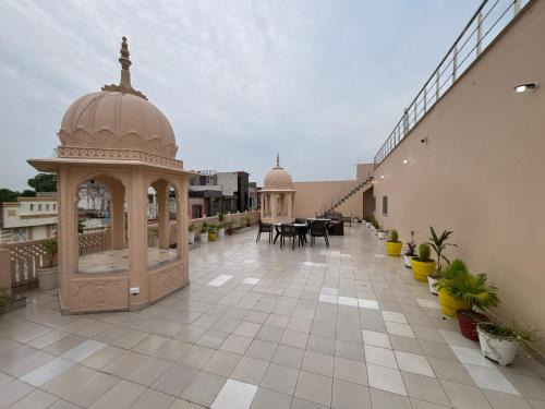 an outdoor patio with a gazebo on a building at The Taj Vista Agra -walking distance to Taj Mahal in Agra