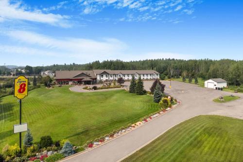 an aerial view of a house with a driveway at Super 8 by Wyndham Eveleth in Eveleth