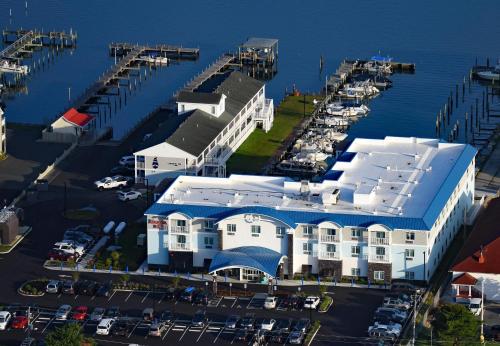 an aerial view of a building at a marina at Marina Bay Hotel & Suites, an Ascend Collection Hotel in Chincoteague