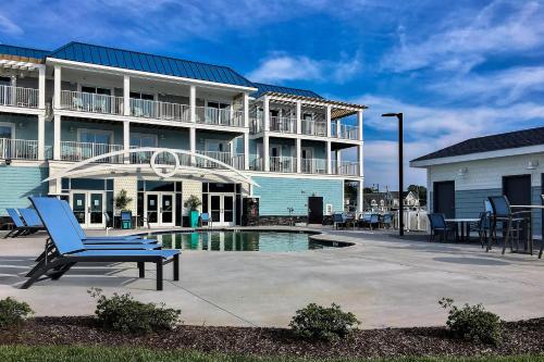 a building with a pool in front of it at Marina Bay Hotel & Suites, an Ascend Collection Hotel in Chincoteague