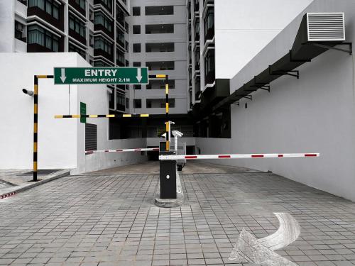 a street sign in front of a building at Spacious 2BR 2BA at d Millenia in Kuching