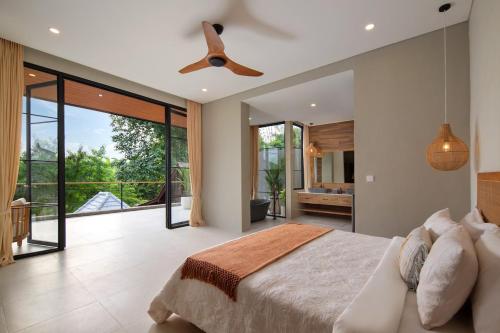 Ένα ή περισσότερα κρεβάτια σε δωμάτιο στο Villa Bersama - Ubud