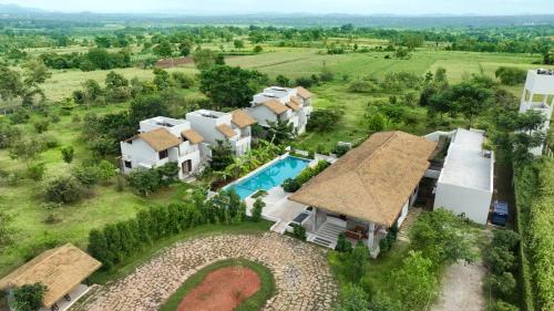 an aerial view of a house with a swimming pool at Wild Origin Kabini - A Luxury Resort in Kabini River