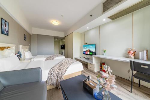 Ένα ή περισσότερα κρεβάτια σε δωμάτιο στο Mihua Times You Apartment