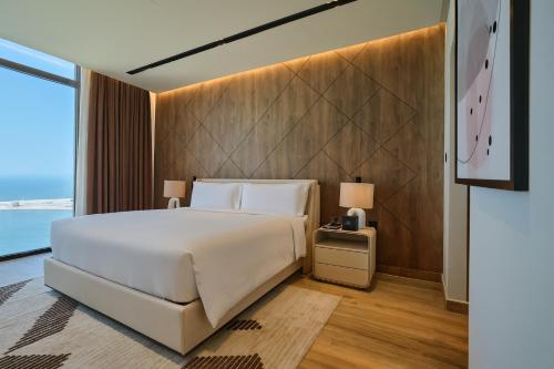 Una cama o camas en una habitación de The OQ