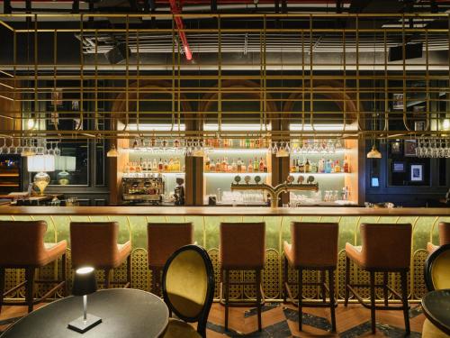 El lounge o bar de The OQ