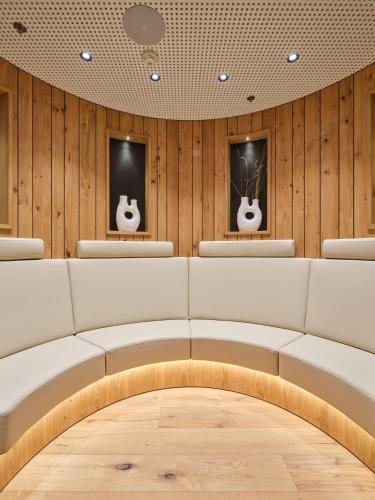 a room with two acoustic guitars on the wall at Hotel Prior & Energy Spa in Zlín