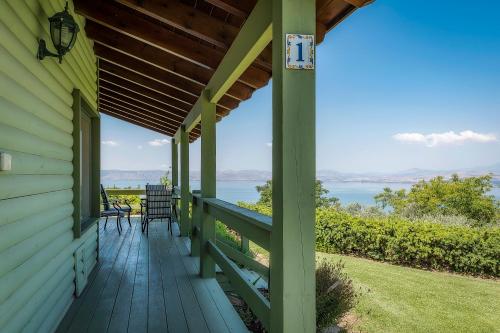 a porch of a house with a view of the water at Sea of Galilee Panoramic View in Moshav Ramot