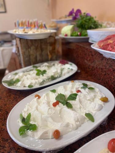 a table with three plates of food on it at Vanda Boutique Hotel & Spa By Rafahia in Jounieh