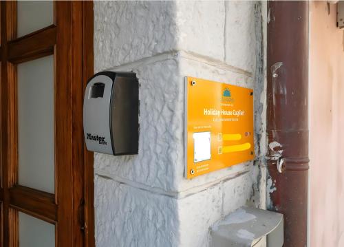 a paper towel dispenser on the side of a wall at St John Apartment in Cagliari