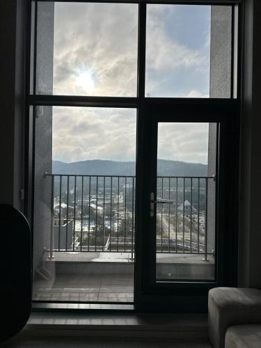 an open window with a view of a balcony at Buldang Hot Place in Ch'ŏnan-yŏk
