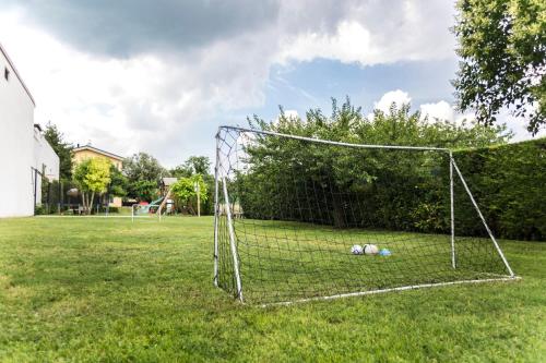 a soccer net with balls in the middle of a field at B&B LA CORTE SANTA MARIA in Negrar