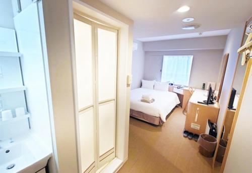 Ένα ή περισσότερα κρεβάτια σε δωμάτιο στο Quintessa Hotel Akita