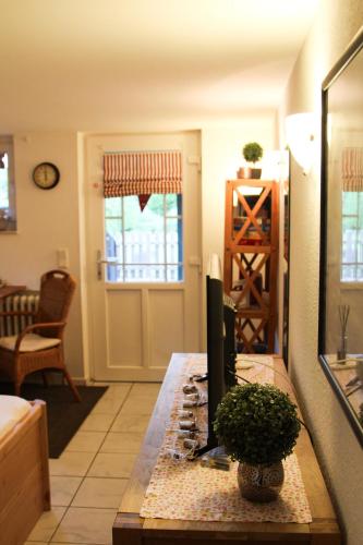a living room with a table with a candle at FeWo Seelücke in Munkbrarup