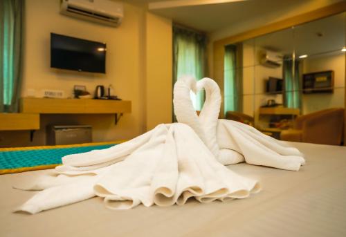 Postel nebo postele na pokoji v ubytování Santrina Hotels