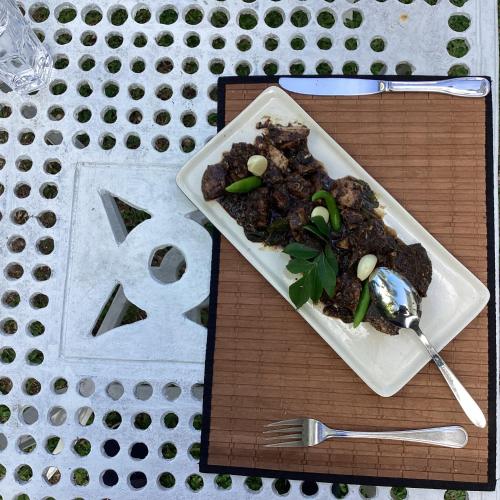 a plate of food sitting on top of a table at Headman House Antique Villa - Ahangama in Ahangama