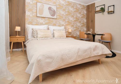 Ένα ή περισσότερα κρεβάτια σε δωμάτιο στο Mandarin Apartment