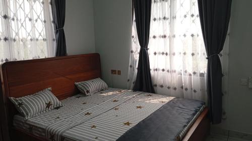 Ένα ή περισσότερα κρεβάτια σε δωμάτιο στο Baoba apartment