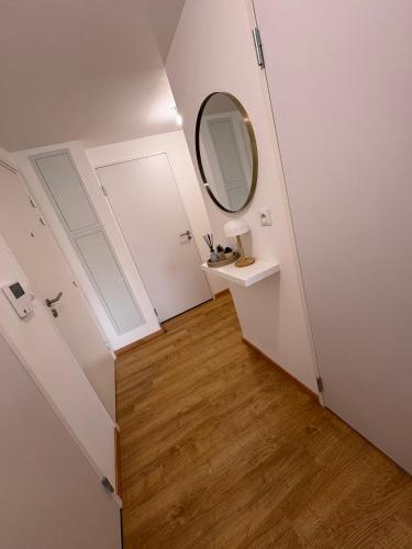 a small bathroom with a mirror and a sink at Garden and sea in Berck in Berck-sur-Mer