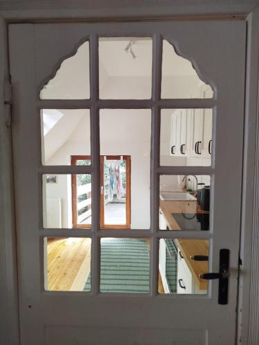 a door with a window in a room at Ottersberg in Ottersberg