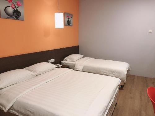Кровать или кровати в номере GPI HOTEL Bentong