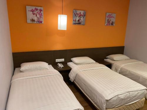 Кровать или кровати в номере GPI HOTEL Bentong