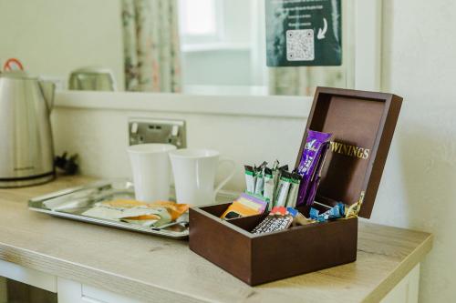 a box sitting on top of a counter next to a sink at The Osborne Hotel in Torquay