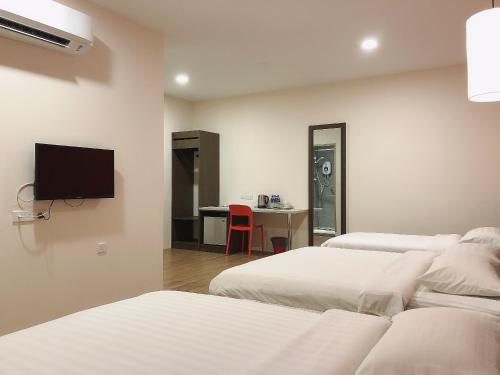 Телевизор и/или развлекательный центр в GPI HOTEL Bentong
