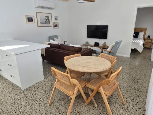 a living room with a table and chairs and a couch at Sou Wester in Lancelin