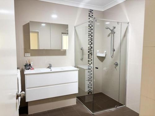 a bathroom with a sink and a shower at Things of Stone and Wood in Lancelin