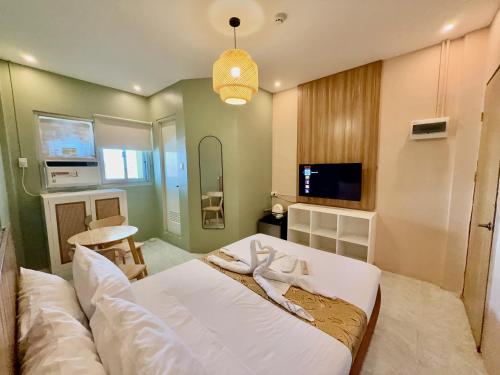 a bedroom with a white bed in a room at ABC Homes PH in Olongapo