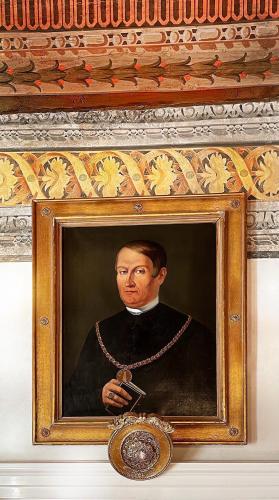 a painting of a man with a rosary at Alchymist Prague Castle Suites Hotel in Prague