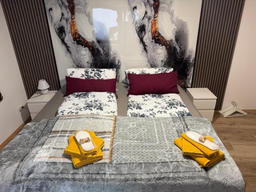 a bedroom with a bed with two yellow shoes on it at Apartment Frühling in Bad Langensalza