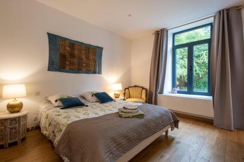 Ένα ή περισσότερα κρεβάτια σε δωμάτιο στο La Maison de Jeanne - 500m de la Plage