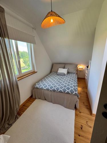 Ένα ή περισσότερα κρεβάτια σε δωμάτιο στο Cabin120 Siemiany- Slowlife na Pojezierzu Iławskim
