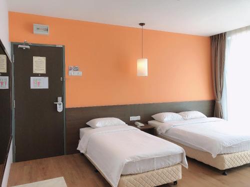 Кровать или кровати в номере GPI HOTEL Bentong