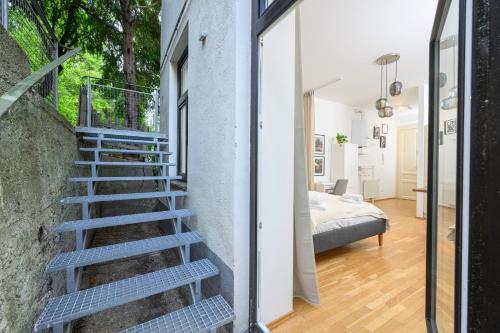 a staircase leading to a bedroom in a house at Quiet & Comfortable Studio Apartment in Vienna in Vienna