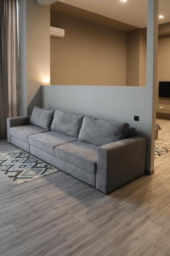 a living room with a couch in a room at REST INN apart hotel in Cherkasy