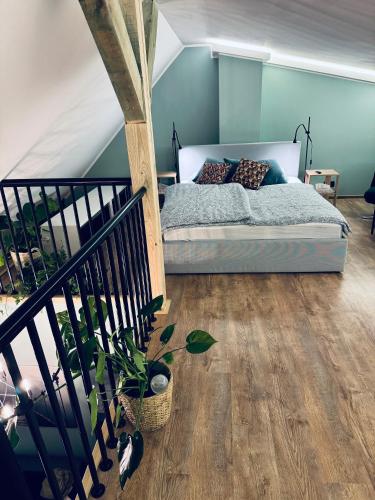 Un ou plusieurs lits dans un hébergement de l'établissement Apartament Przystań